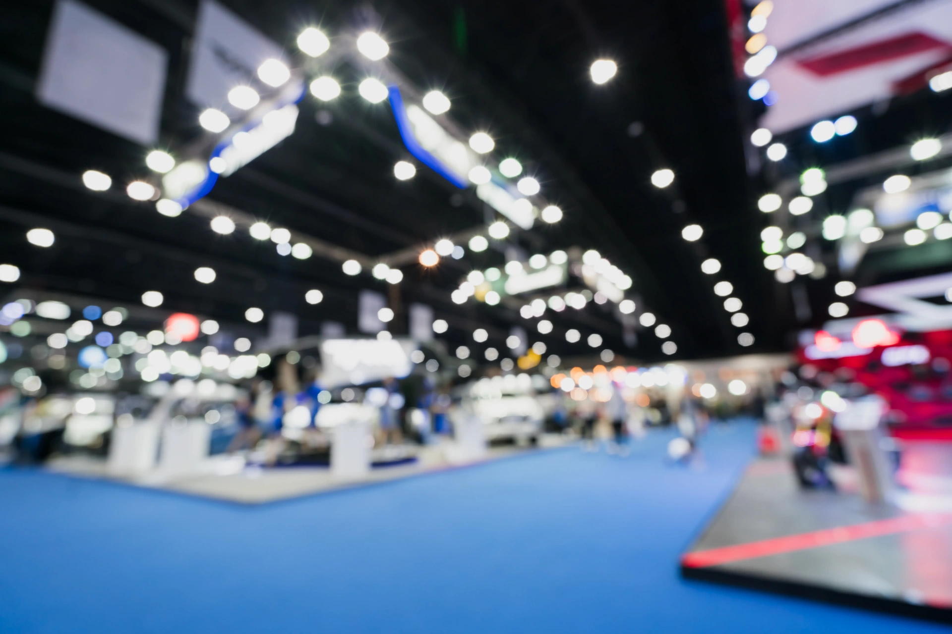 Trade show convention floor with exhibition booths and lighting